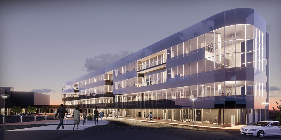 Architectural rendering of a four-floor office building at night. Each level is lit internally from the overhead lights creating a warm and inviting glow.